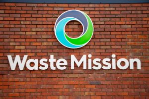 Alchemy Metals rebrands as Waste Mission 3 Waste Mission Logo on the wall